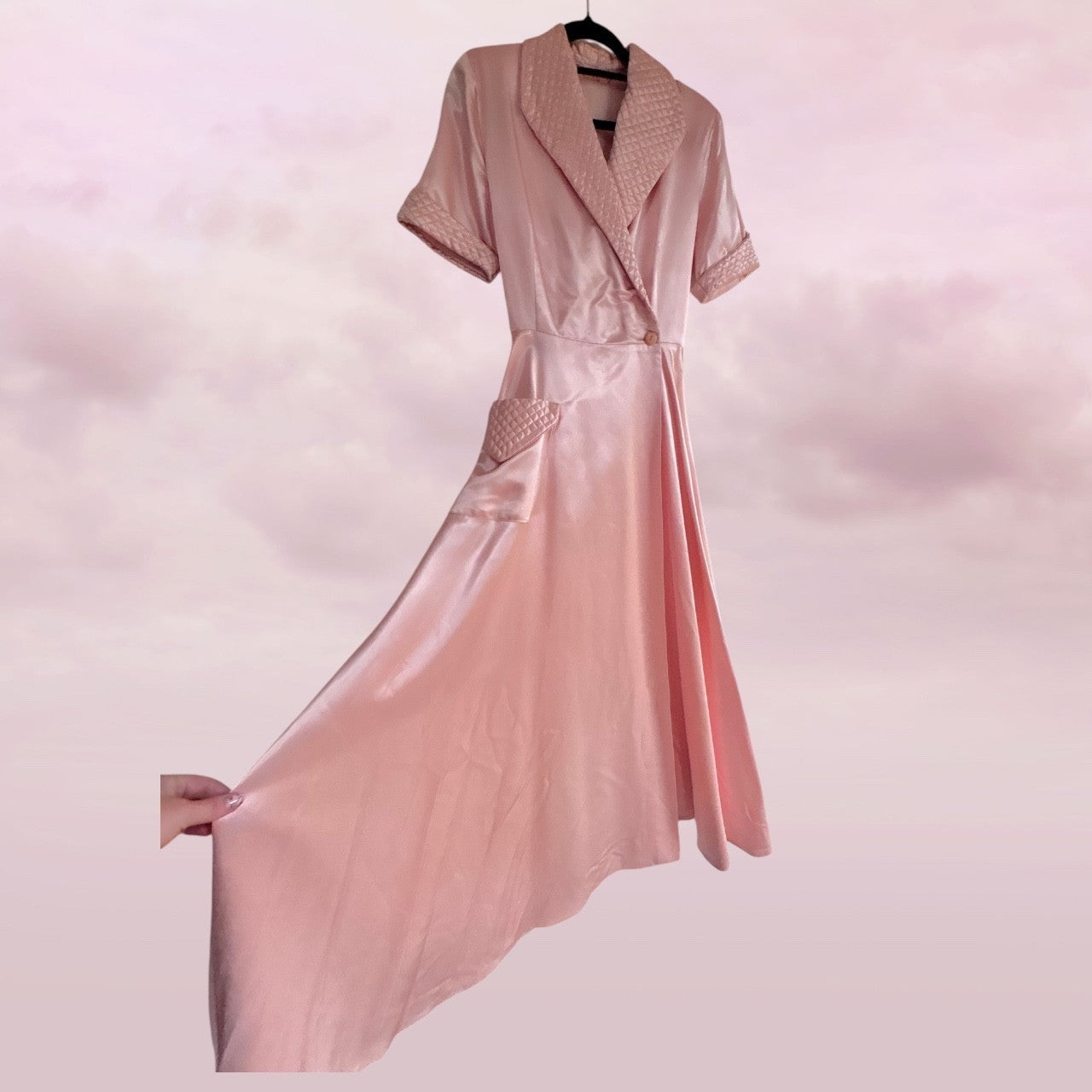 Pink dress with matching jacket on a pink background