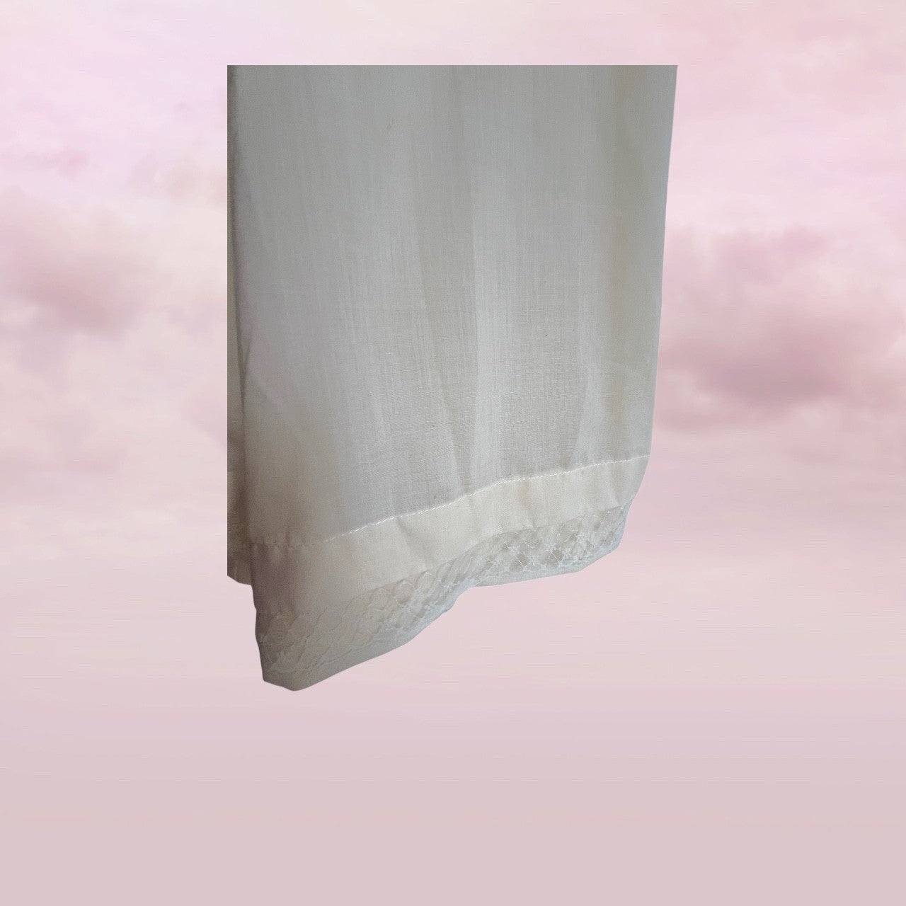 Rectangular block of light gray stone on a pink gradient background