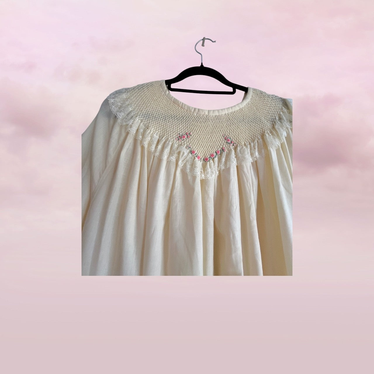 Vintage-style nightgown with floral embroidery on a pink background