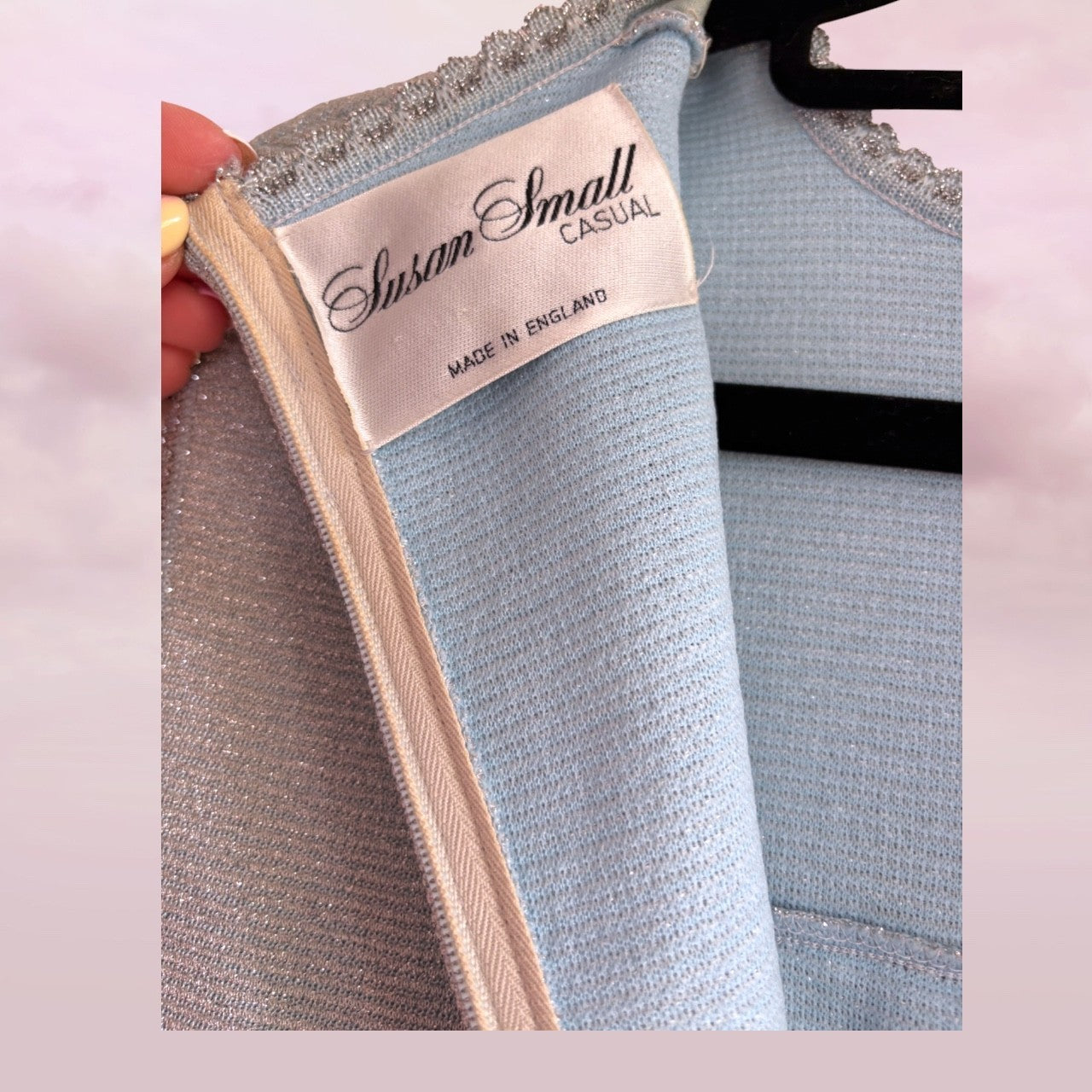 Light blue textured garment on a hanger with 'Susan Small Casual' label.