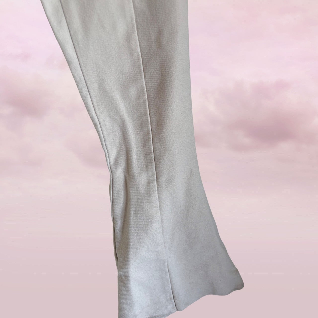 white pants on a pink background