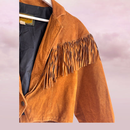 Brown suede jacket with fringes on a white background
