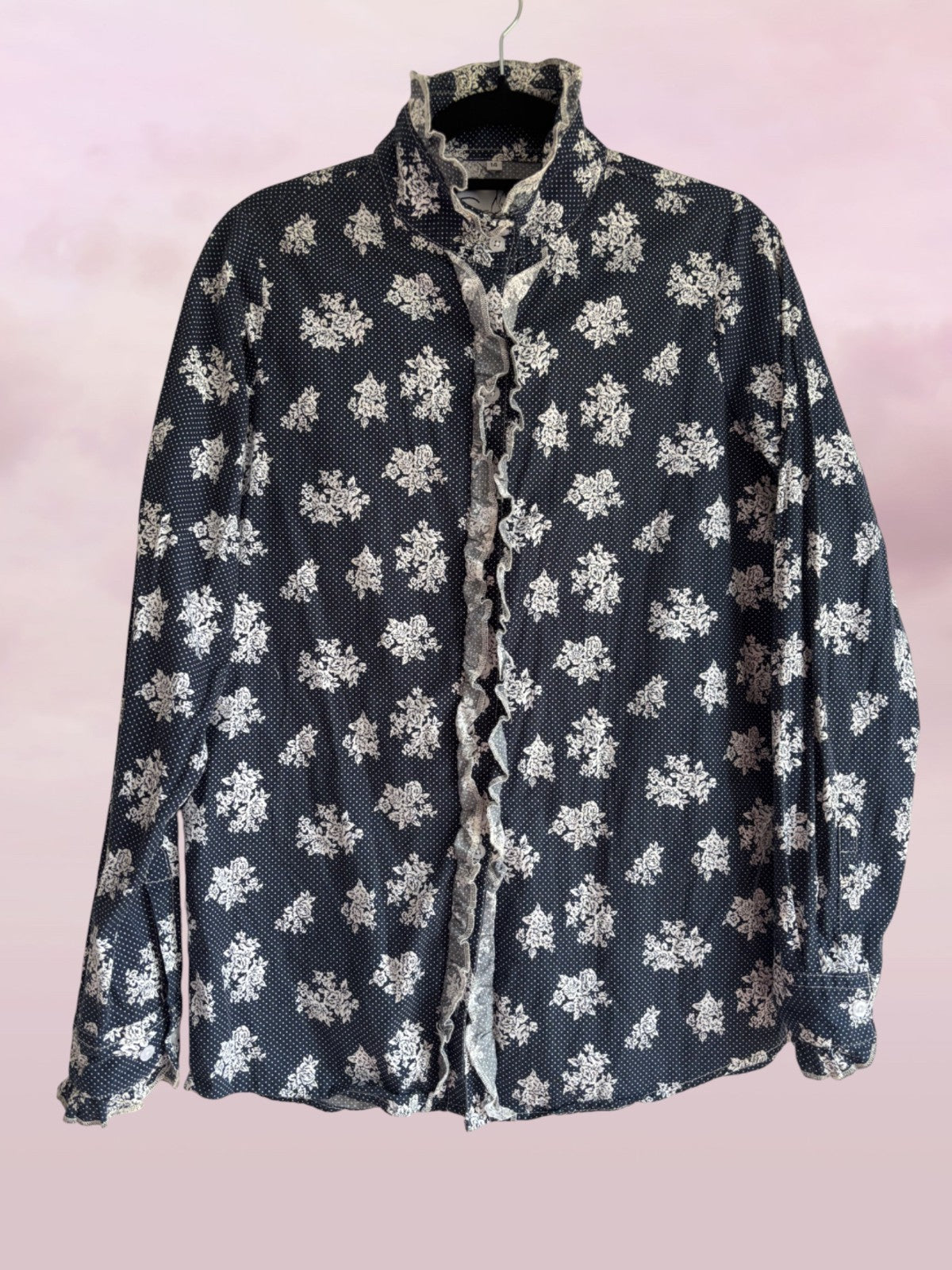 Floral patterned shirt on a pink background