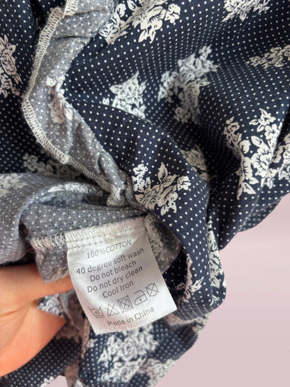 Clothing label on a piece of fabric with floral pattern
