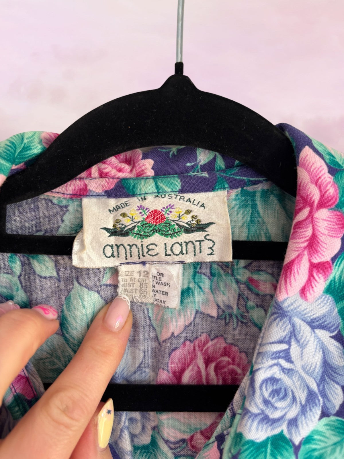 Floral shirt with 'Annie Lant' label on a hanger