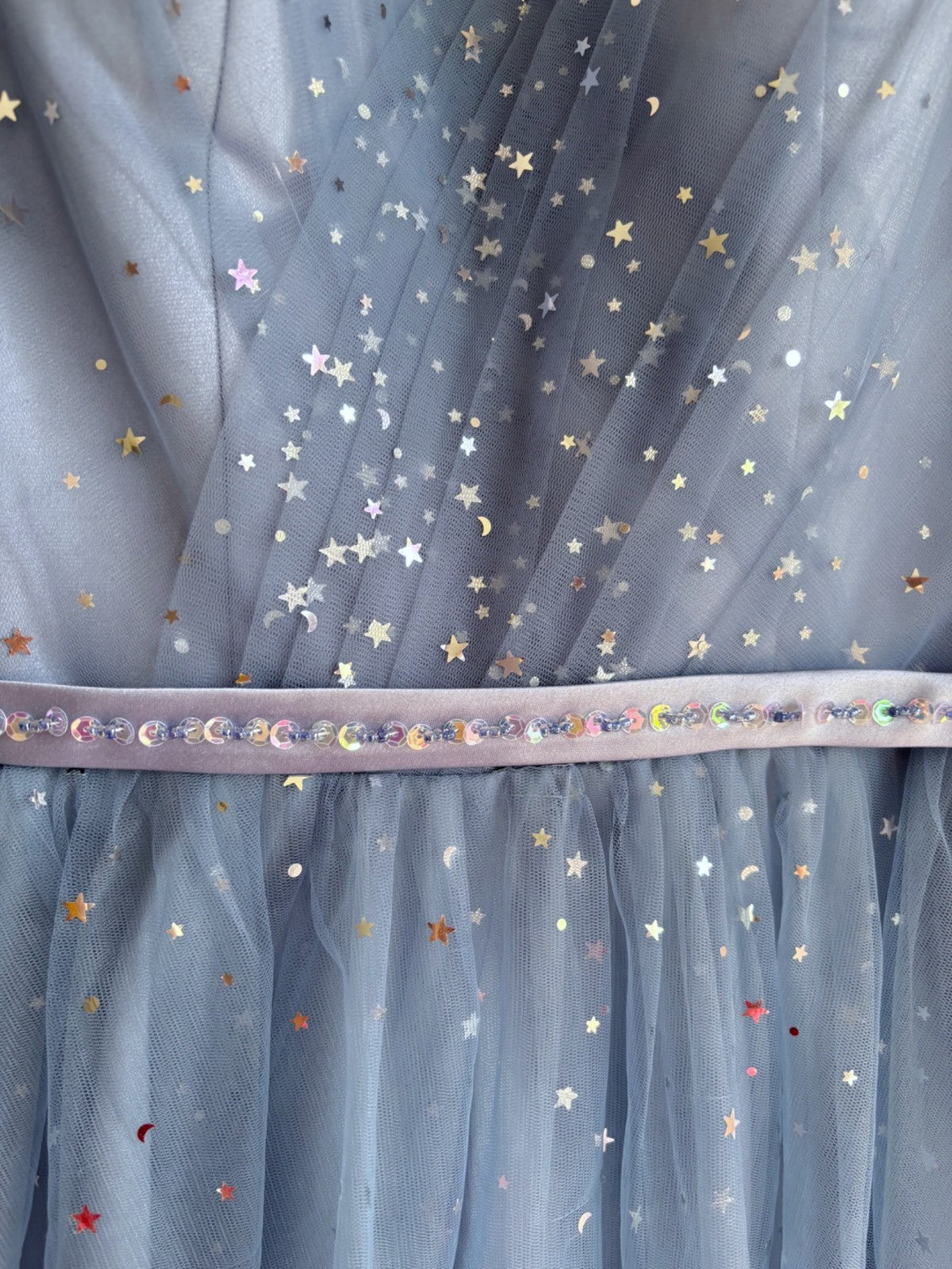 Blue tulle fabric with star and moon patterns