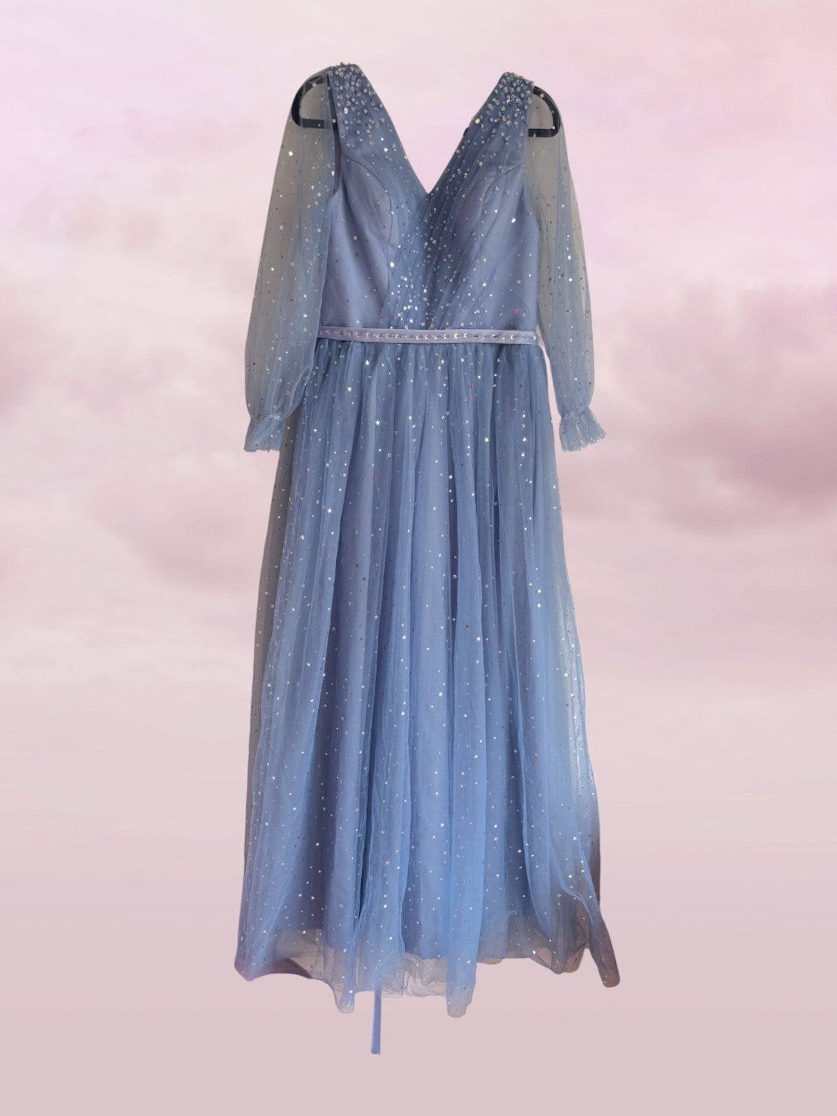 Blue dress with sheer sleeves on a light pink background