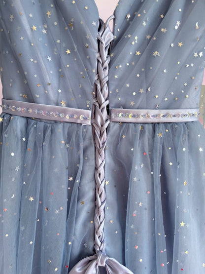 Blue dress with star patterns and braided belt detail