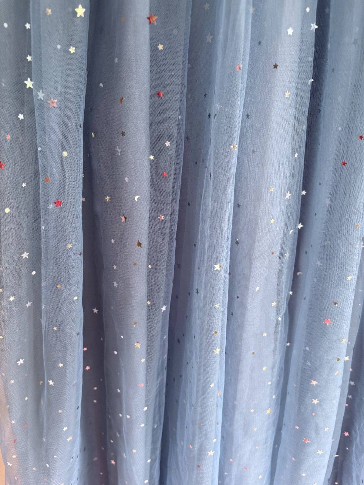 Sheer blue dress with star patterns