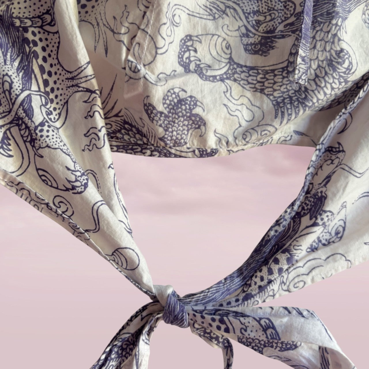 Patterned fabric with a bow on a pink background