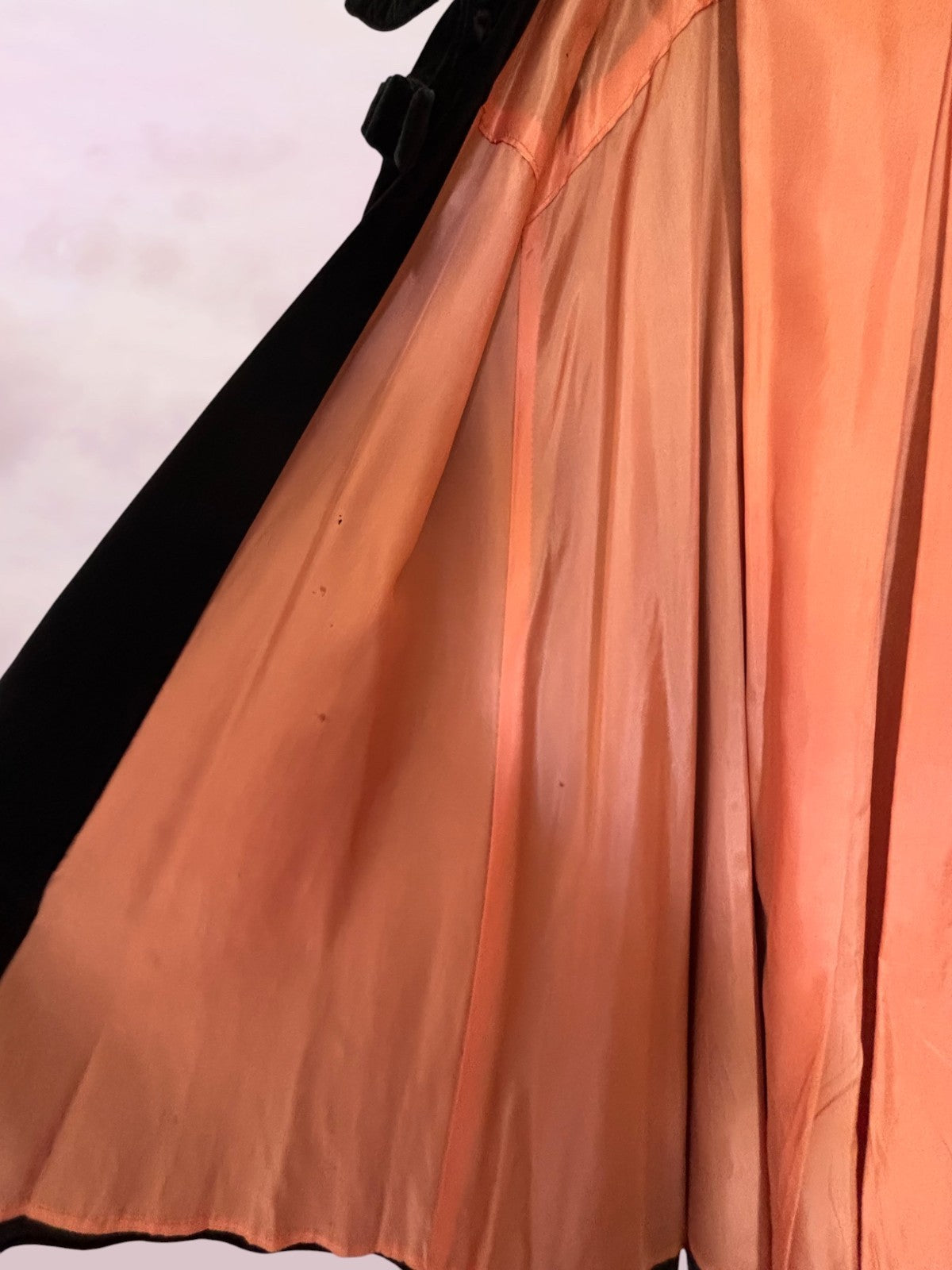 Close-up of a peach-colored garment with a blurred background