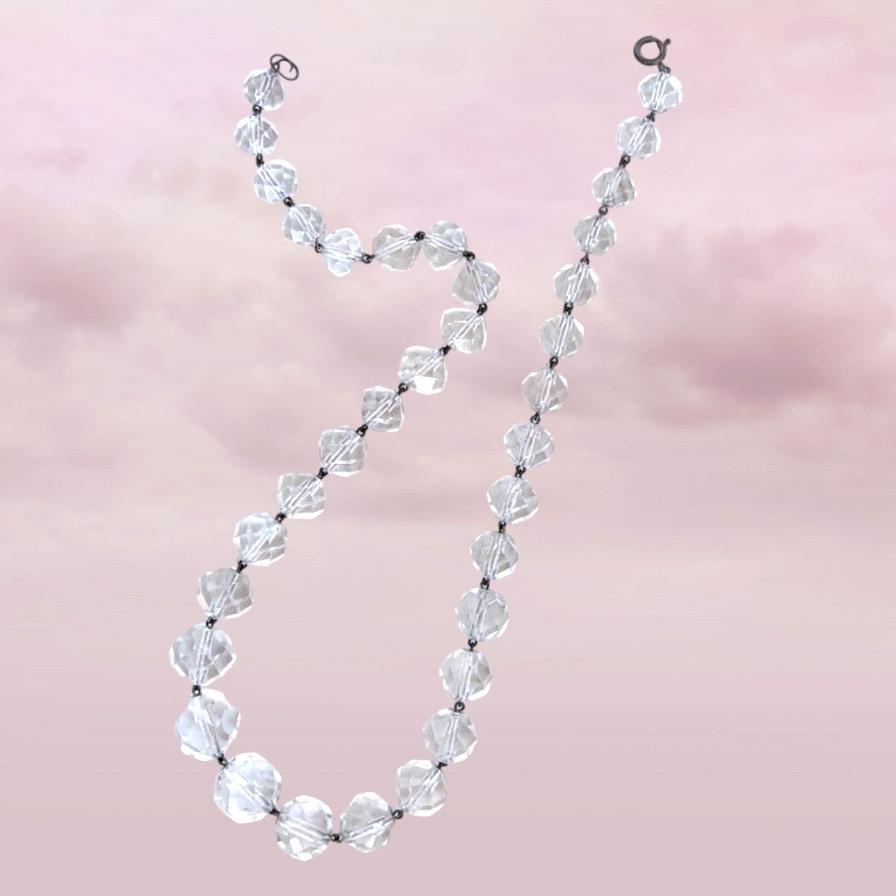 Clear faceted crystal beads linked with metal wire on mid-century vintage necklace